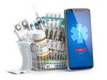 Mobile service or app for purchasing medicines in online pharmacy drugstore. Smartphone and shopping basket full of medicines