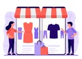 Mobile shopping, shop to online. Man and woman buy things in online store through phone app. Choose clothes through Royalty Free Stock Photo