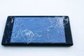 Mobile smart phone with broken screen on white backgrou Royalty Free Stock Photo