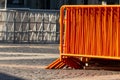 Mobile steel fence. orange street barriers to restrict movement before the concert Royalty Free Stock Photo