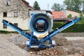 A mobile stone crusher or building rubble shredder for crushing construction material, stones and bricks