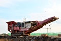 Mobile Stone crusher machine by the construction site or mining quarry for crushing old concrete