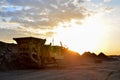 Mobile Stone crusher machine by the construction site or mining quarry for crushing old concrete slabs into gravel Royalty Free Stock Photo