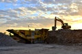 Mobile Stone crusher machine by the construction site or mining quarry for crushing old concrete slabs into gravel