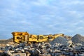 Mobile Stone crusher machine by the construction site or mining quarry for crushing old concrete slabs into gravel and subsequent Royalty Free Stock Photo