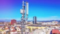 Mobile telecommunication cellular radio network antennas on a mast on the roof Royalty Free Stock Photo