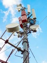 Telecommunication tower of mobile telephone network base station with smart cellular antennas radiating strong signal Royalty Free Stock Photo