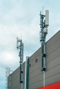 Mobile telephony base station and signal repeater antenna on industrial building