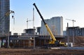 Mobile telescopic boom crane on bridge construction. Truck crane on building bridges. Road work on traffic highway, road Royalty Free Stock Photo