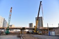 Mobile telescopic boom crane on bridge construction. Truck Crane work on building bridges. Road work on traffic highway, road Royalty Free Stock Photo