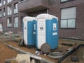 Mobile toilets cabins, dixie closet, WC. Toilets for construction workers on a construction site in front of a building