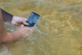 Mobile touch phone in a beach and water