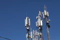 Mobile towers on blue sky background. Many communication equipment