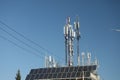 Mobile towers on blue sky background. Many communication equipment