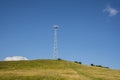 Mobile transmitter on a green hill Royalty Free Stock Photo