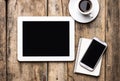 Mobile workplace with tablet PC, phone and cup of coffee Royalty Free Stock Photo