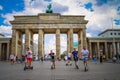 Mobility in Berlin, Germany. Scooter rental in front of the Brandenburg Gate