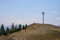 Mobility cell site on a shale covered mountain top, self-supporting tower with panel antennas
