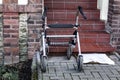 Mobility walker parked at the bottom of steps