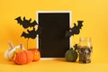 mocap black sign and halloween decor on a bright yellow background