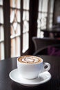 Mocha coffee drink on a wood table by the window Royalty Free Stock Photo