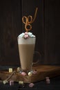 Mocha Coffee with marshmallow in glass on the wooden table Royalty Free Stock Photo
