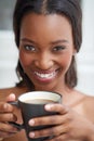 Mocha makes my morning. A young ethnic woman enjoying a cup of coffee. Royalty Free Stock Photo
