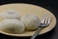 Close-up of Japanese rice cakes, or mochi, on a dessert plate against black background Royalty Free Stock Photo