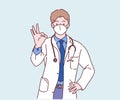 Male doctor wearing face mask and showing OK sign, smiling and confident.