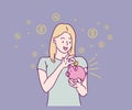 Saving money, happy woman putting coin into piggy bank.