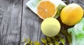 Mock up aromatherapy spa concept with bath bombs and fresh lemons on wooden background.