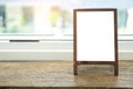 Mock up blank advertising whiteboard with easel standing on wood