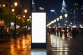 Mock up of a blank billboard on a city street at night Royalty Free Stock Photo