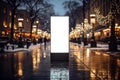 Mock up of a blank billboard on a city street at night Royalty Free Stock Photo