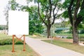 Mock up. Blank billboard outdoors, outdoor advertising, public information board in the city park Royalty Free Stock Photo