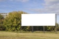 Mock up. Blank billboard outdoors, outdoor advertising, public information board on city road Royalty Free Stock Photo