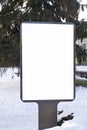 Mock up. Blank billboard outdoors, outdoor advertising, public information board in the city winter time Royalty Free Stock Photo