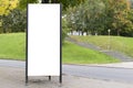 Mock up. Blank billboard outdoors, outdoor advertising, public information board near city park. Royalty Free Stock Photo