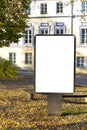 Mock up. Blank billboard outdoors, outdoor advertising, public information board stand at city park in autumn day Royalty Free Stock Photo