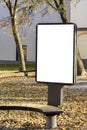 Mock up. Blank billboard outdoors, outdoor advertising, public information board stand at city park in autumn day Royalty Free Stock Photo