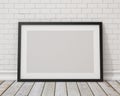Mock up blank black horizontal picture frame on the white concrete wall and the vintage floor Royalty Free Stock Photo