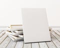 Mock up blank canvas or poster with pile of canvas on floor and wall, background