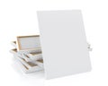 Mock up blank canvas or poster with pile of canvas on floor and wall, background