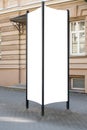 Mock up. Blank outdoor advertising column outdoors, public information board in the street. Royalty Free Stock Photo