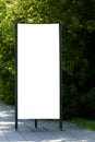 Mock up. Blank outdoor advertising column outdoors, public information board in the street. Royalty Free Stock Photo