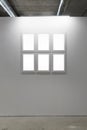 Mock up. Blank picture frames on white wall. Gallery wall with empty frames indoor. Royalty Free Stock Photo