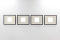 Mock up. Blank picture frames on white wall. Gallery wall with empty frames indoor. Royalty Free Stock Photo