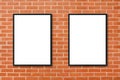 Mock up blank poster picture frame hanging on red brick wall background in room. Royalty Free Stock Photo