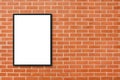 Mock up blank poster picture frame hanging on red brick wall background in room. Royalty Free Stock Photo