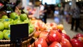 Mock up blank sign price tag display in supermarket Interior, apple basket Royalty Free Stock Photo